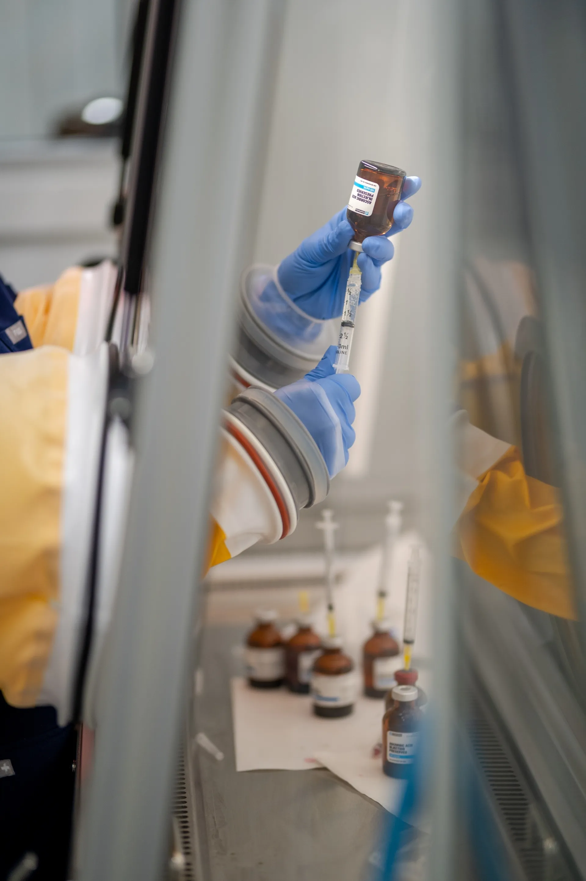 Drawing a vitamin dose in the compounding hood
