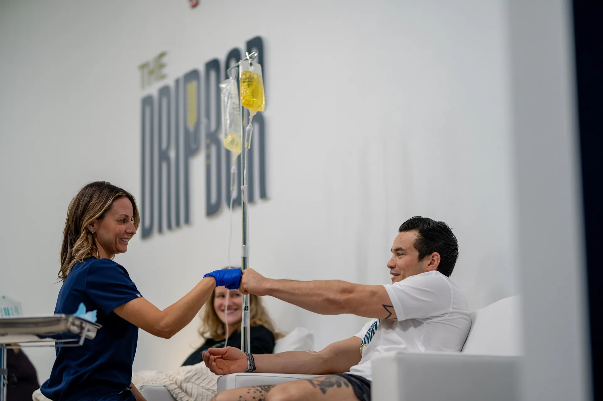 Nurse and client fist-bumping