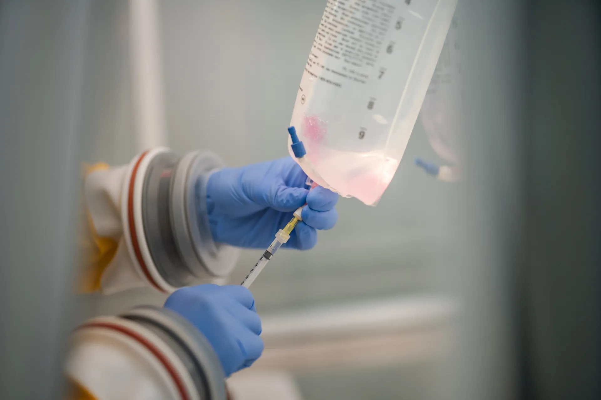 Compounding a drip inside the isolator hood